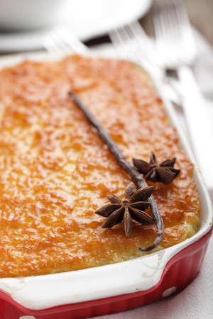 Rice pudding in the baking dish with spices