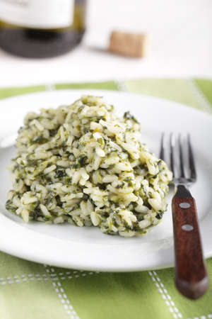 Risotto with spinach on the white plateの写真素材