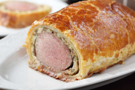 Medium-rare Beef Wellington on the plate closeupの写真素材