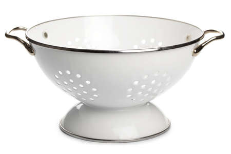 White enamel colander isolated on white backgroundの写真素材