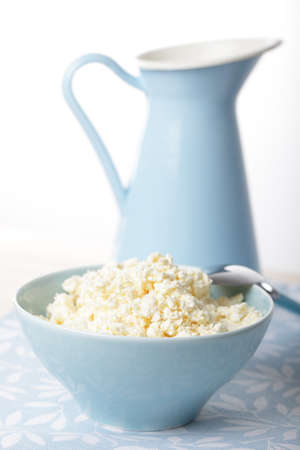 Homemade cottage cheese in the blue bowlの写真素材