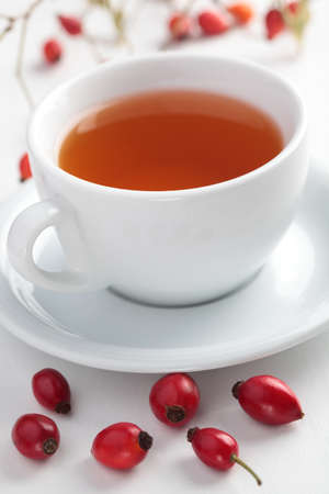 Rose hip tea in white cup closeupの写真素材