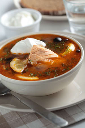 Solyanka, Russian soup with salmon, olives and sour cream