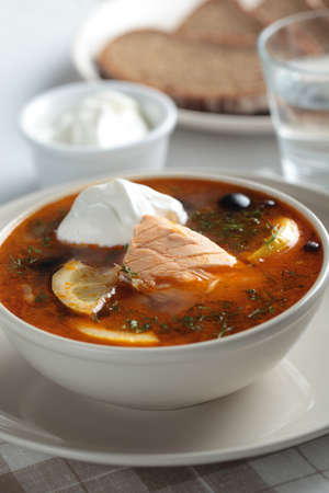 Solyanka, Russian soup with salmon, olives and sour creamの写真素材