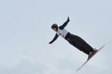 Bukovel, Ukraine - February 23, 2013: Denis Osipau, Belarus performs aerial skiing during Freestyle...