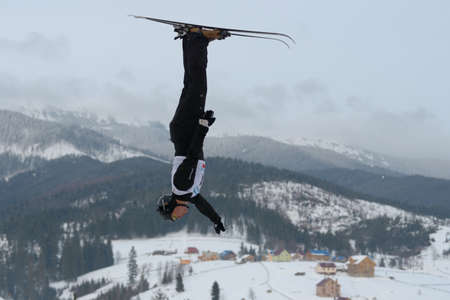 Bukovel, Ukraine - February 23, 2013: Oleksandr Abramenko, Ukraine performs aerial skiing during Freestyle Ski in Bukovel, Ukraine on February 23, 2013.のeditorial素材