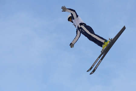 Bukovel, Ukraine - February 23, 2013: Michael Rossi, USA performs aerial skiing during Freestyle Ski World Cup in Bukovel, Ukraine on February 23, 2013.のeditorial素材