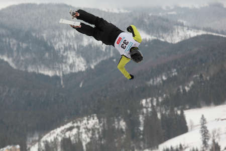 Bukovel, Ukraine - February 23, 2013: Sergii Lysianskyi, Ukraine performs aerial skiing during Freestyle Ski World Cup in Bukovel, Ukraine on February 23, 2013.のeditorial素材