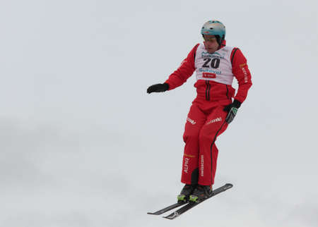 Bukovel, Ukraine - February 23, 2013: Andreas Isoz, Switzerland performs aerial skiing during Freestyle Ski World Cup in Bukovel, Ukraine on February 23, 2013.のeditorial素材