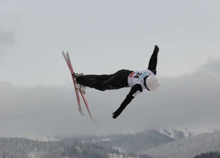 Bukovel, Ukraine - February 23, 2013: Naoya Tabara, Japan performs aerial skiing during Freestyle Ski World Cup in Bukovel, Ukraine on February 23, 2013.のeditorial素材