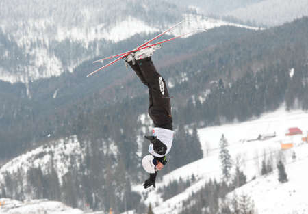 Bukovel, Ukraine - February 23, 2013: Naoya Tabara, Japan performs aerial skiing during Freestyle Ski World Cup in Bukovel, Ukraine on February 23, 2013.のeditorial素材