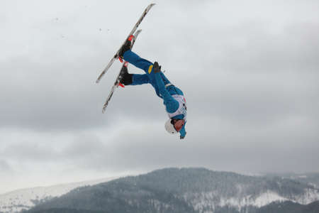 Bukovel, Ukraine - February 23, 2013: Mykola Puzderko, Ukraine performs aerial skiing during Freestyle Ski World Cup in Bukovel, Ukraine on February 23, 2013.のeditorial素材