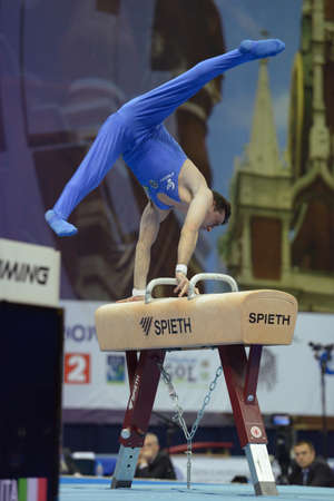 Moscow, Russia - April 20, 2013: Alberto Busnari, Italy performs exercise on pommel horse in final of 5th European Championships in Artistic Gymnastics in Moscow, Russia on April 20, 2013のeditorial素材
