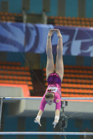 Moscow, Russia - April 20, 2013: Aliya Mustafina, Russia performs exercise on uneven bars in final of 5th European Championships in Artistic Gymnastics in Moscow, Russia on April 20, 2013のeditorial素材