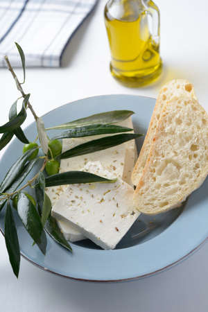 Feta cheese, bread, and olive oilの写真素材