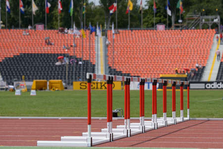 Donetsk, Ukraine - July 11, 2013: Row of hurdles on the track of stadium during 8th World Youth Championships in Donetsk, Ukraine on July 11, 2013のeditorial素材