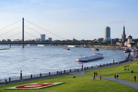 Dusseldorf, Germany - June 29, 2013: Barges on the Rhine river in Dusseldorf, Germany on June 29, 2013. Rhine is one of the worlds most busiest waterwaysのeditorial素材