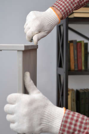 Man assembling the wooden chestの写真素材
