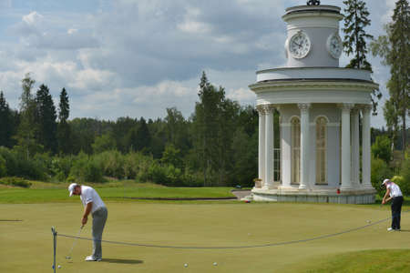 Tseleevo, Moscow region, Russia - July 24, 2014: Golfers warm up on the golf course in the Tseleevo Golf & Polo Club during the M2M Russian Open. This international golf tournament is the stage of the European Tourのeditorial素材