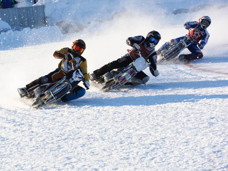 Novosibirsk, Russia - December 20, 2014: Unidentified bikers during the semi-final individual rides of Russian Ice Speedway Championship. The sports returns to the sport arenas after a declineのeditorial素材
