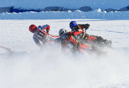 Novosibirsk, Russia - December 20, 2014: Unidentified bikers during the semi-final individual rides of Russian Ice Speedway Championship. The sports returns to the sport arenas after a declineのeditorial素材
