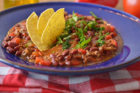 Chili con carne with tortilla chipsの写真素材