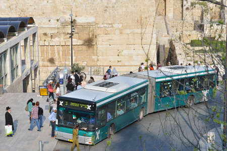 Jerusalem, Israel - March 20, 2014: People on the bus stop The Western Wall in the Old City. The Old City is listed as UNESCO World Heritage site since 1981.のeditorial素材