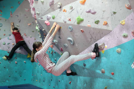 Dnepropetrovsk, Ukraine - April 11, 2015: Girls train during the open bouldering festival Dnepr Montana Kids. The festival organized by the climbing wall Montana and the local association of extreme sportsのeditorial素材