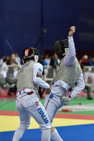 St. Petersburg, Russia - May 1, 2015: Andrea Baldini of Italy vs Sergey Byk of Belarus during the first day of competitions in 41th International fencing tournament St. Petersburg Foil. The tournament is the stage of FIE World Cupのeditorial素材