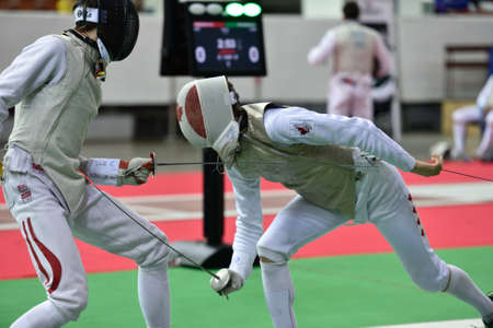 St. Petersburg, Russia - May 1, 2015: Martin Dobiasch of Austria vs Anthony Prymack of Canada during the first day of competitions in 41th International fencing tournament St. Petersburg Foil. The tournament is the stage of FIE World Cupのeditorial素材
