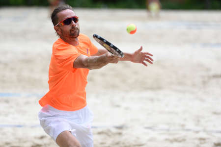 Moscow, Russia - May 31, 2015: Sergey Kuptsov in the match of Russian beach tennis championship. 120 adults and 28 young athletes compete in the tournamentのeditorial素材