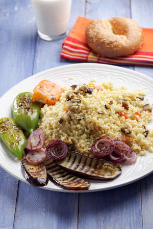 Bulgur pilaf with grilled eggplant, pepper, and onionの写真素材