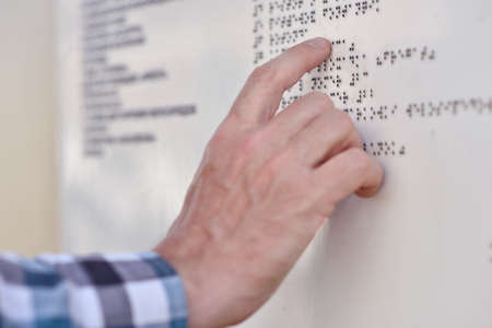 Man reading the Braille plateの写真素材