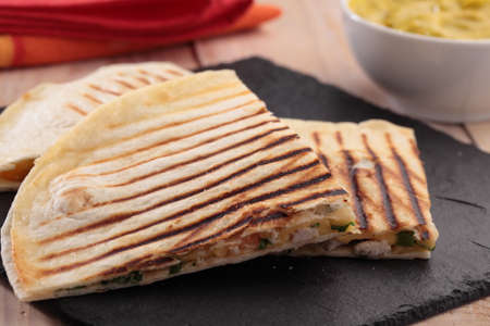 Sincronizada and Guacamole on a rustic table