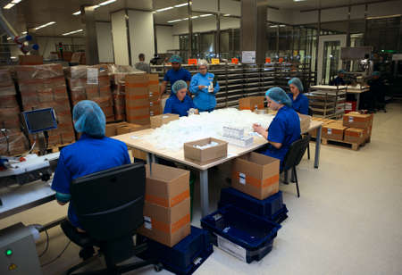 St. Petersburg, Russia - September 24, 2015: Workers packing the injections in the Solopharm plant....