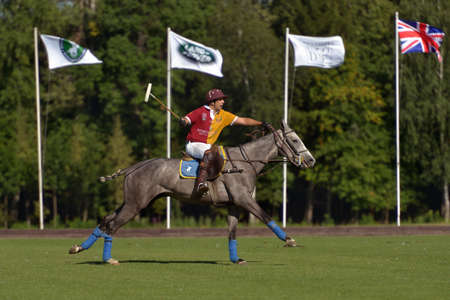 Tseleevo, Moscow region, Russia - July 26, 2014: Francisco Ramos of Tseleevo Polo club in action during the match against the Oxbridge polo team during the British Polo Day. Oxbridge won 5-4のeditorial素材