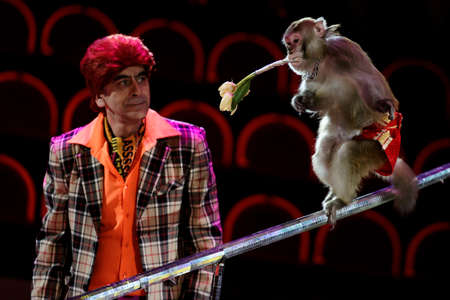 St. Petersburg, Russia - June 2, 2016: Kamal Jabraylov and trained monkey in the dress rehearsal of the Show of Water, Fire, And Light in the Ciniselli circus. This new show of Anatoly Sokol first time arrived in St. Petersburgのeditorial素材