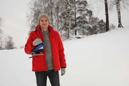 Mature man with skates outdoorsの写真素材