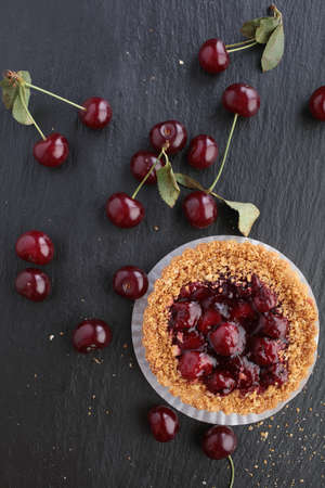 Sour cherry cake and fresh fruitsの写真素材