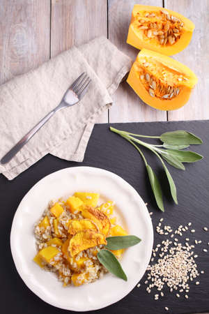 Pearl barley risotto with pumpkin and sage leafの写真素材