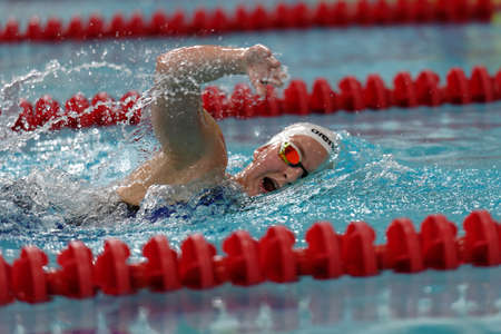 St. Petersburg, Russia - December 16, 2016: Female athlete competes in 800 m freestyle swimming competition during X Salnikov Cup. Athletes from 6 countries participated in the competitionsのeditorial素材