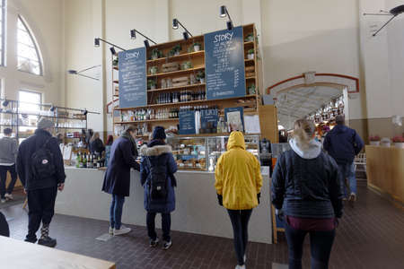 Helsinki, Finland - April 08, 2017: People buying food in the Old Market Hall. The building was...