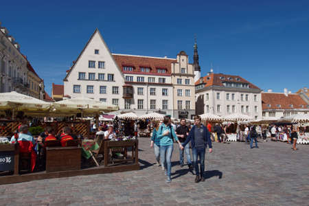 Tallinn, Estonia - June 10, 2017: People resting on the Town Hall square. The Old Town is one of the best preserved medieval cities in Europe and is listed as a UNESCO World Heritage Siteのeditorial素材