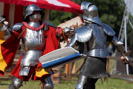 St. Petersburg, Russia - July 9, 2017: Armored knight fighting in the tournament during the military history project Battle On Neva at St. Peter and Paul fortress. It's the 4th such an eventのeditorial素材