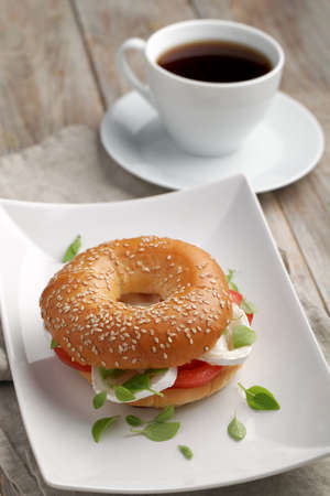 Bagel sandwich with goat cheese and vegetables