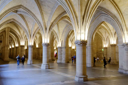 Paris, France - September 13, 2013: Tourist in Salle des Gens d'Armes in Conciergerie. The hall was...