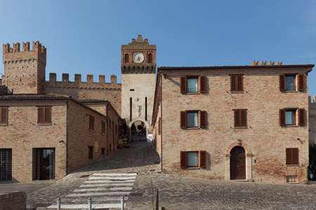 Gradara, Italy - June 16, 2017: Tourists going by the Umberto I street to the Gradara castle. The Gradara Castle dates back to the period between 11th and 15th centuriesのeditorial素材