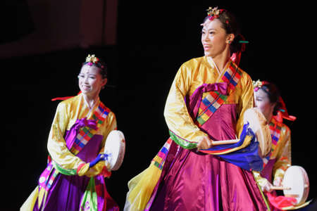 Saint-Petersburg, Russia - February 6, 2018: Dance group Bihua performs the dance with tambourines during the Dance festival of young people of China and Russia. Six choreographic groups take part in the eventのeditorial素材