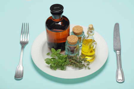 Healthy food concept with olive oil, herbs, and spicesの写真素材