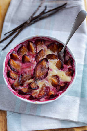 Just baked plum clafoutis. Top viewの写真素材